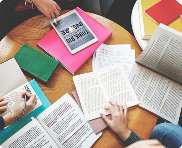 Collaborative planning with books and notes on a table